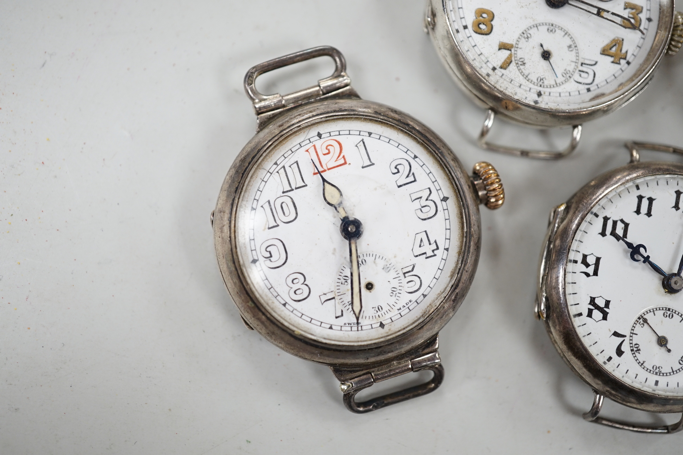 Five assorted early to mid 20th century manual wind wrist watches, including four silver.